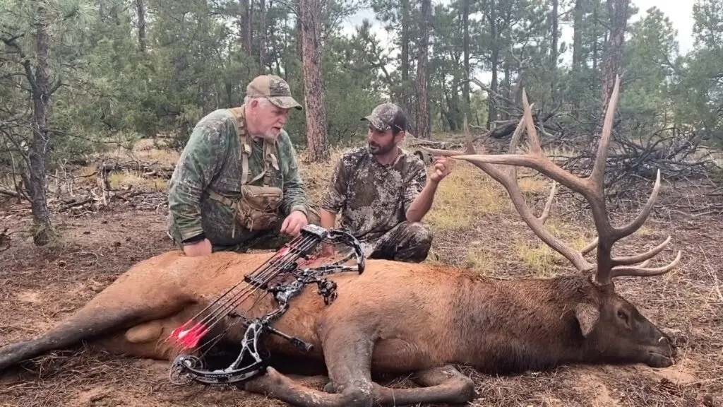 Two-hunters-discussing-their-hunt-of-a-giant-elk