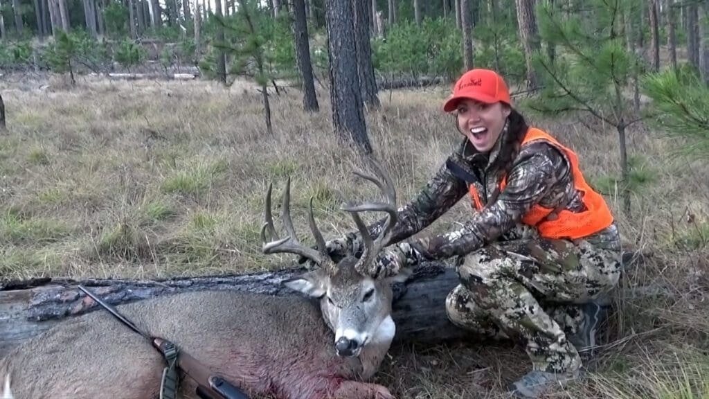 Proud-female-hunter-with-her-new-trouphy-buck